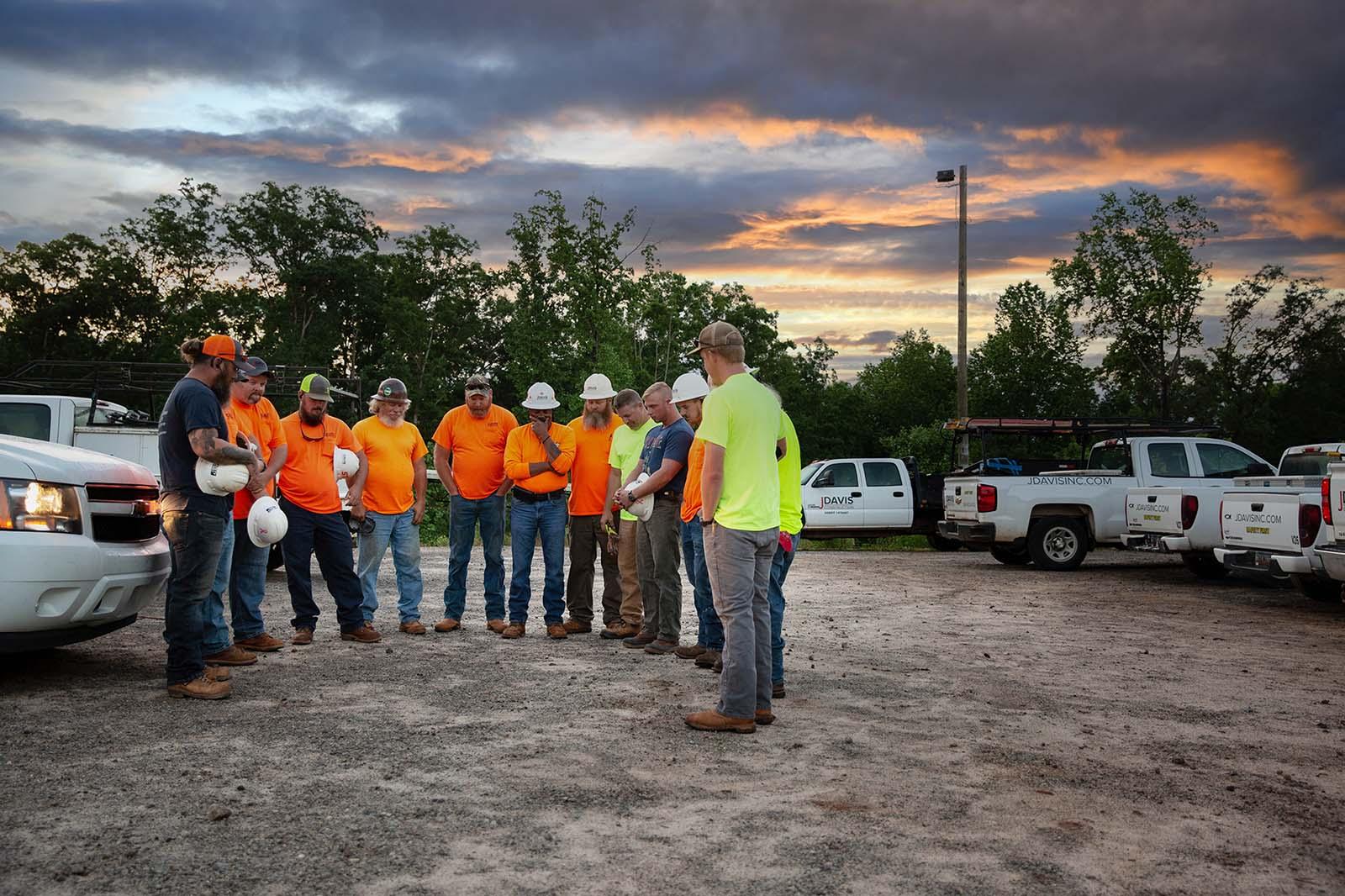 Crew of workers standing in a circle